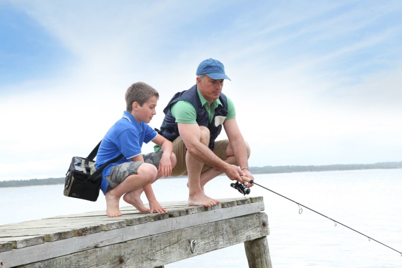 9479165 - father and son fishing in lake