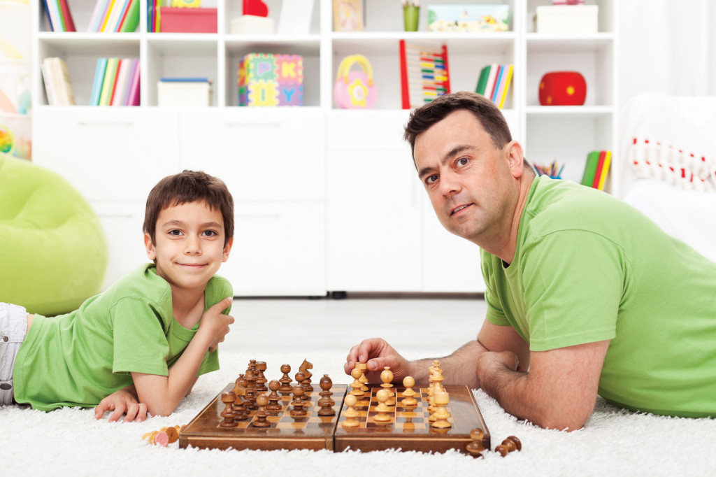 Father and son playing chess